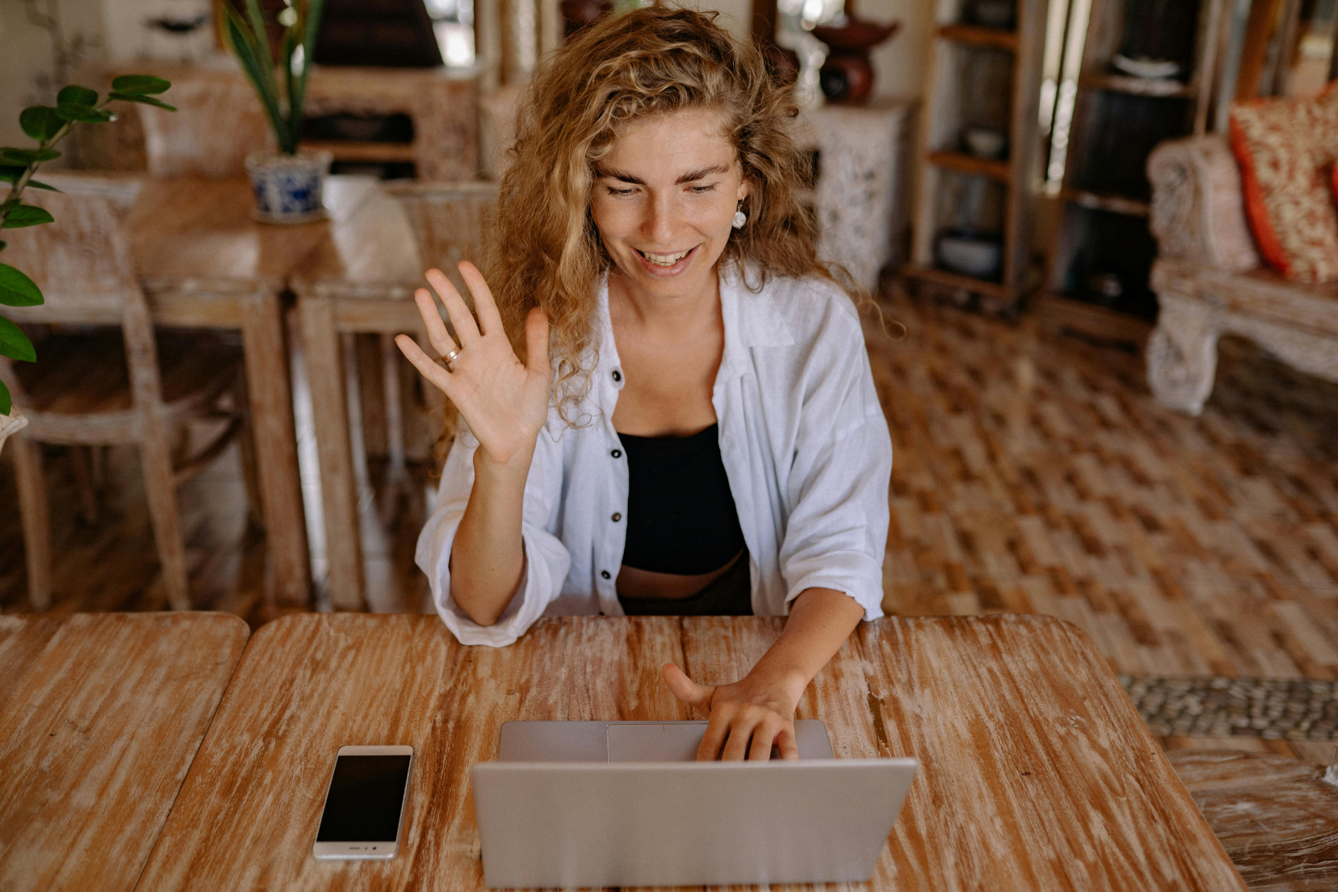 A Benefits Guru greeting someone at the start of a video conversation